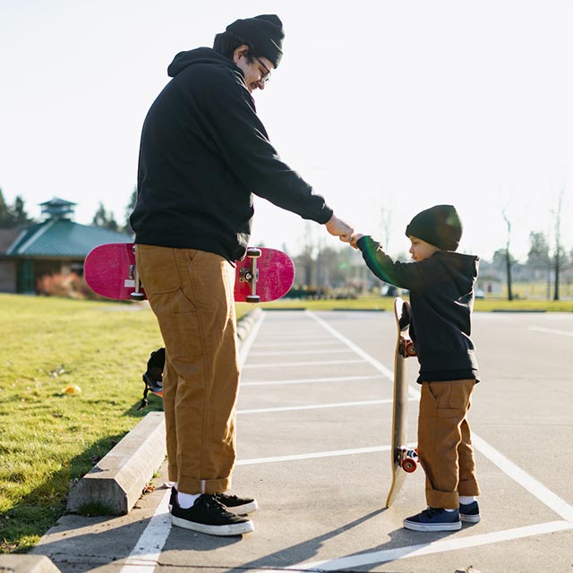 Father and son with skateboards