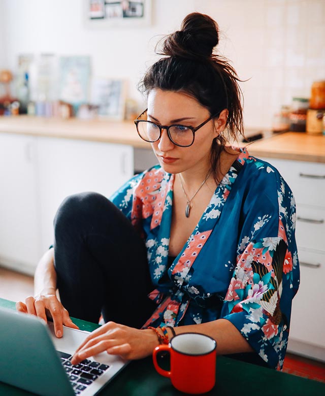 woman using laptop at home