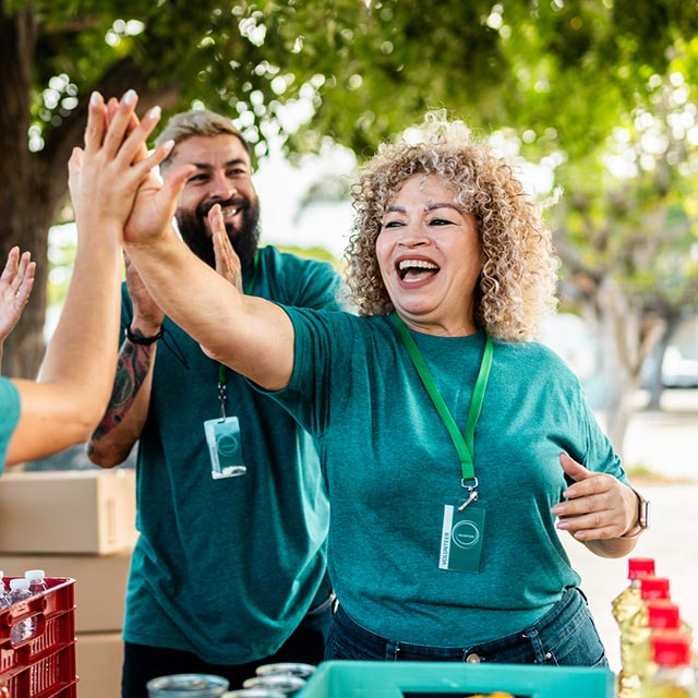 Group of volunteers giving high fives