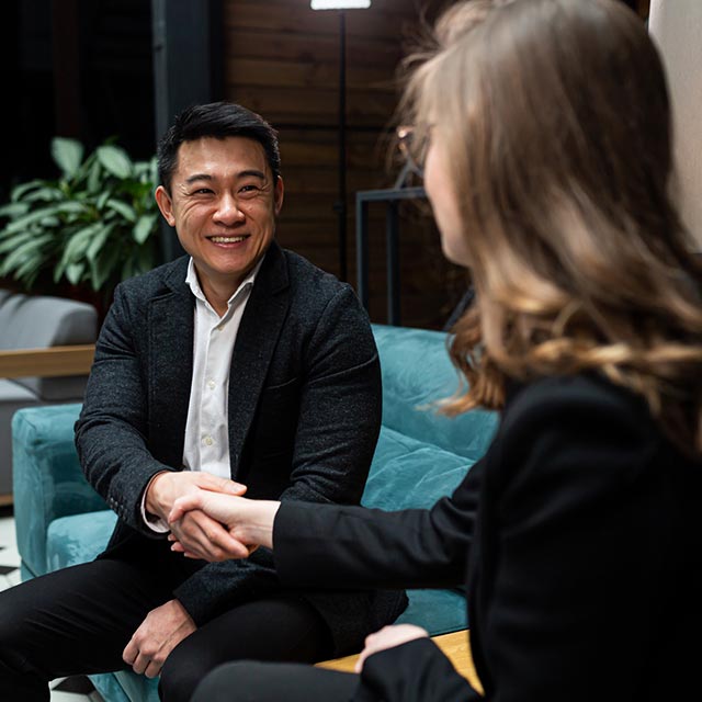 Two business people shaking hands