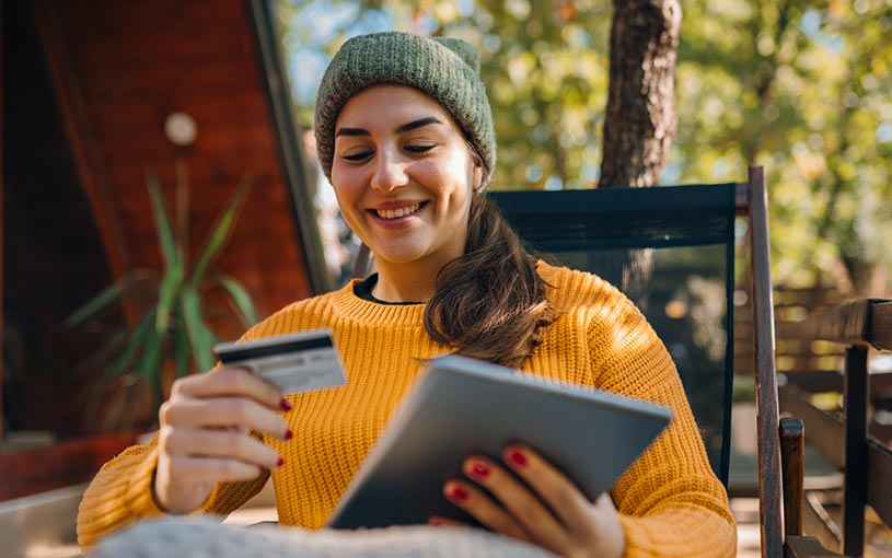 woman with card and tablet